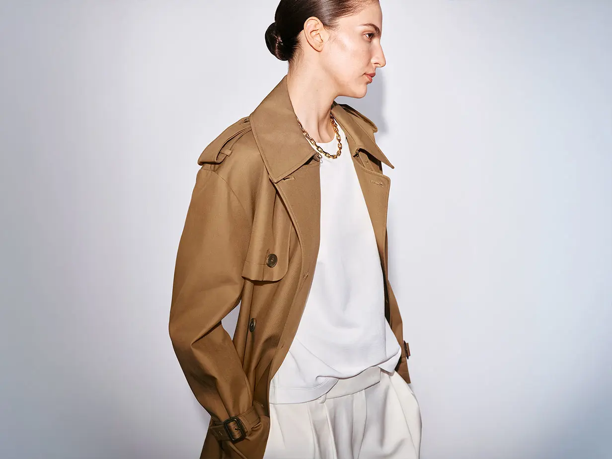 Woman wearing caramel trench coat