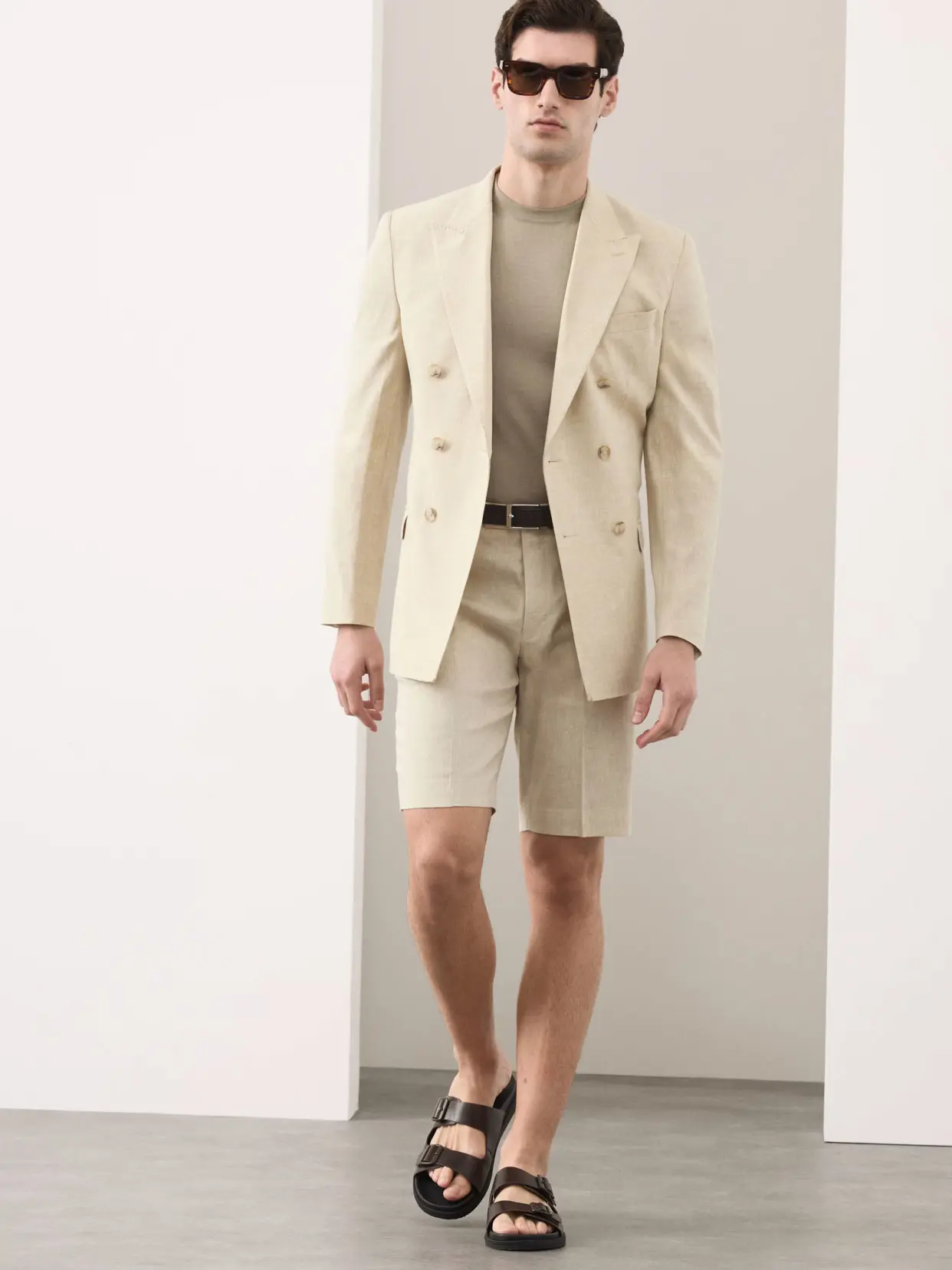Man wearing neutral blazer and matching shorts