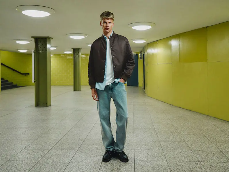Man in bomber jacket and jeans