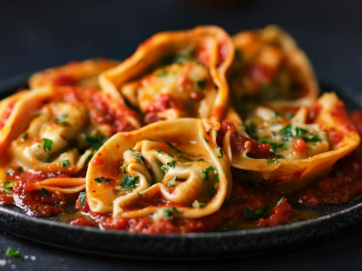Pasta on black plate