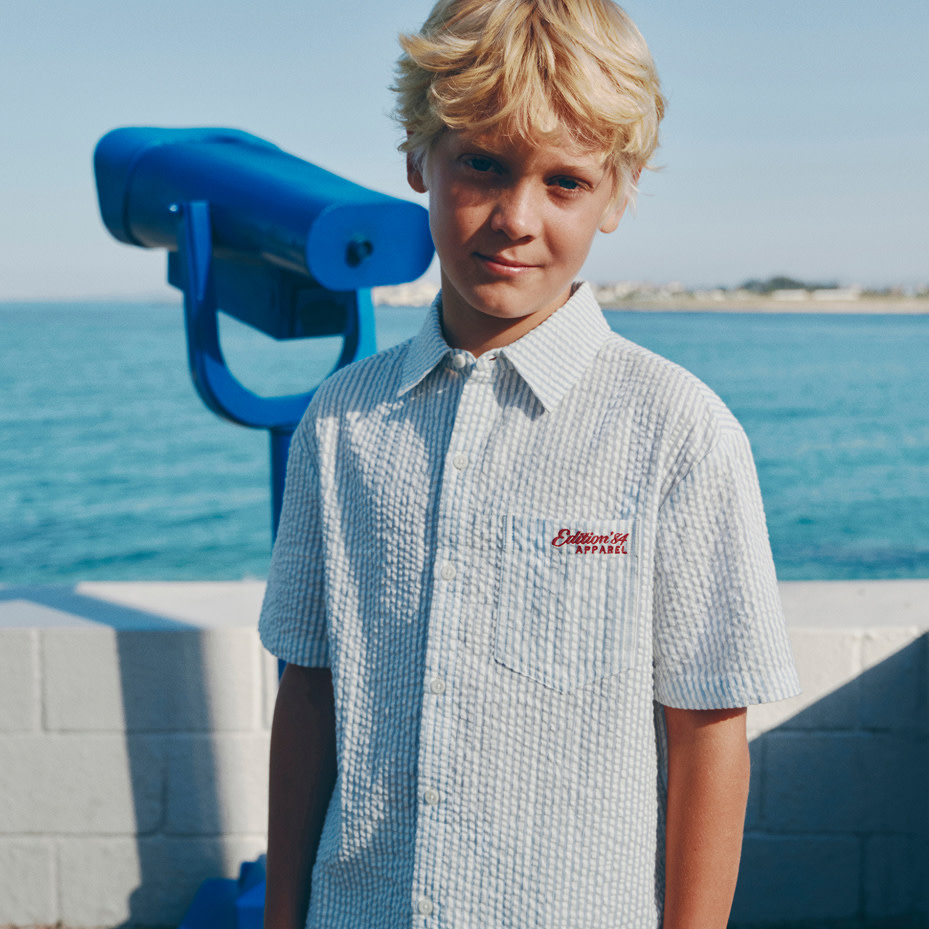Boy wearing blue shirt