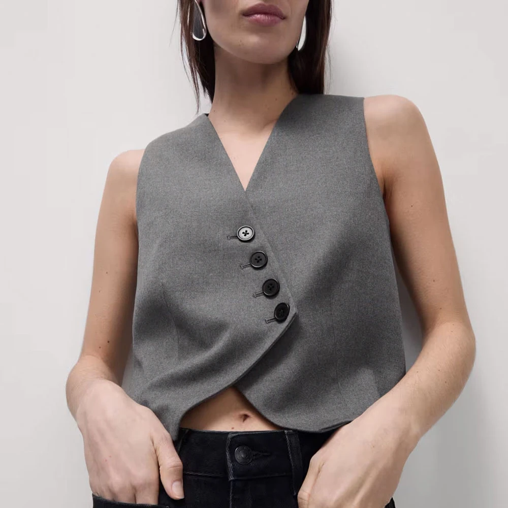 Woman wearing grey button-down waistcoat