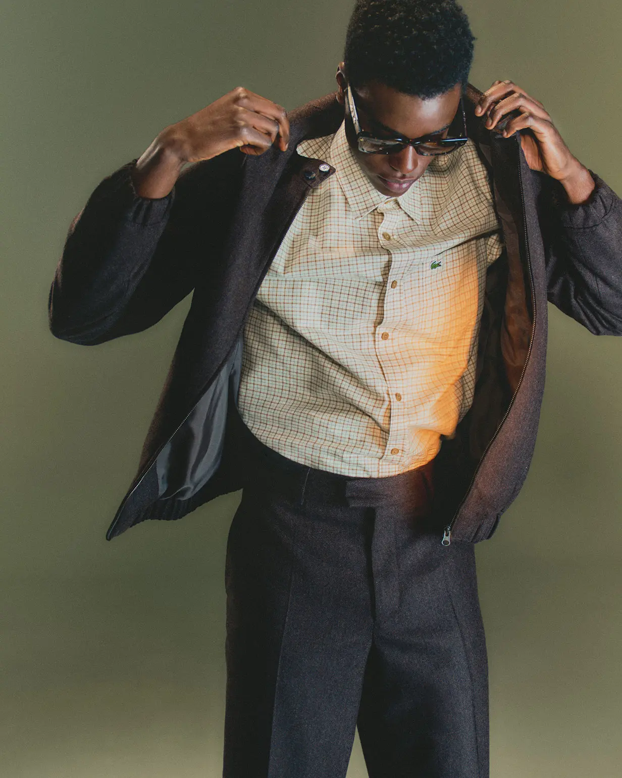 Man wearing Lacoste jacket, shirt and trousers