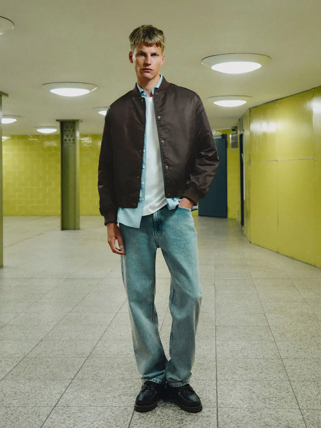 Man in bomber jacket and jeans