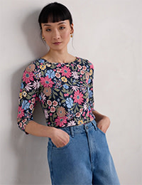 Women wear floral top in a seasalt brand. Shop now