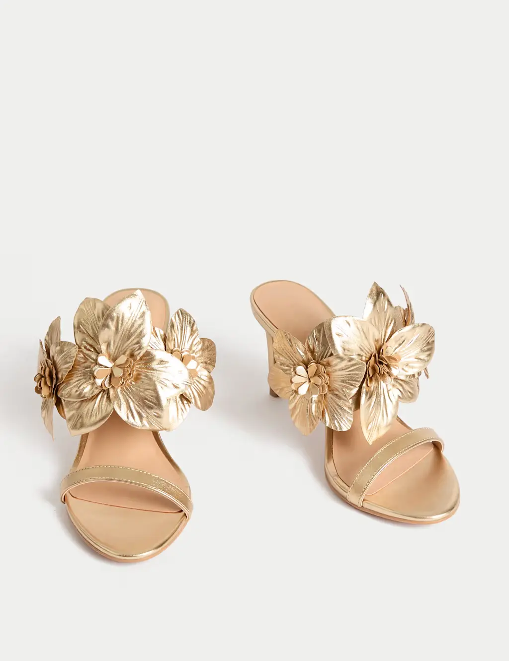A pair of gold corsage heels