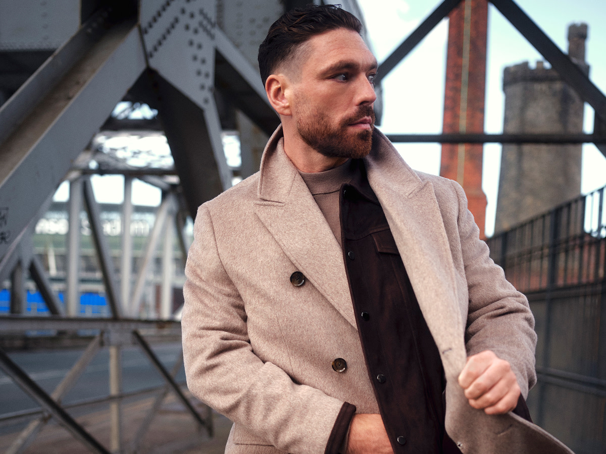 Man wearing beige coat