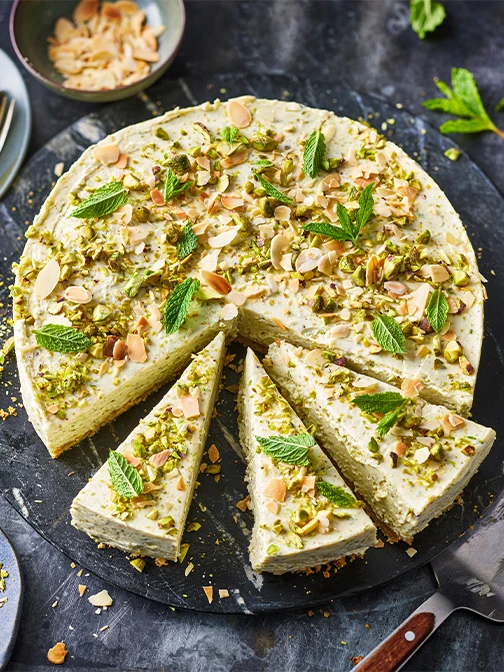 Pistachio cheesecake on black plate