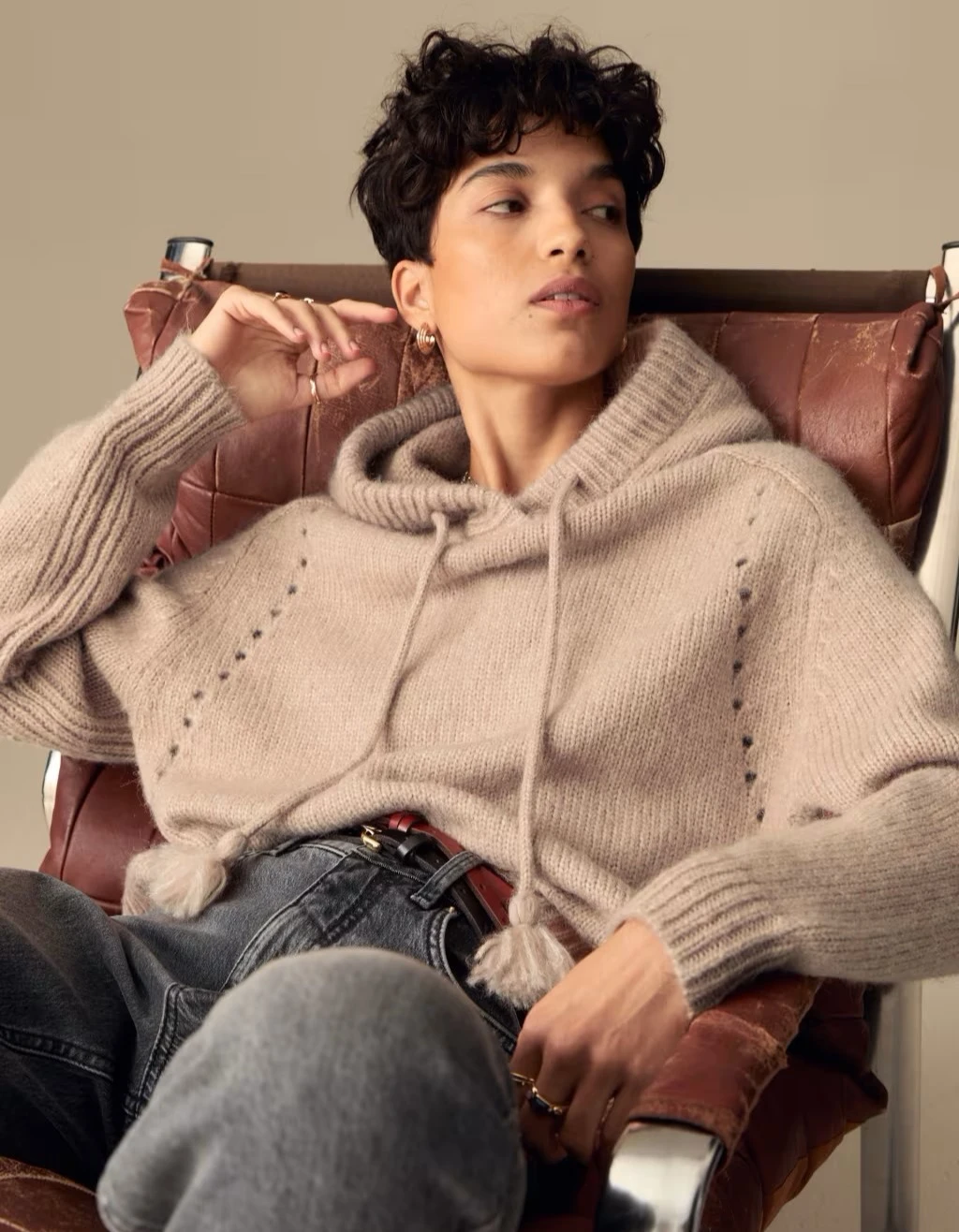 Woman wearing knitted hooded jumper at M&S