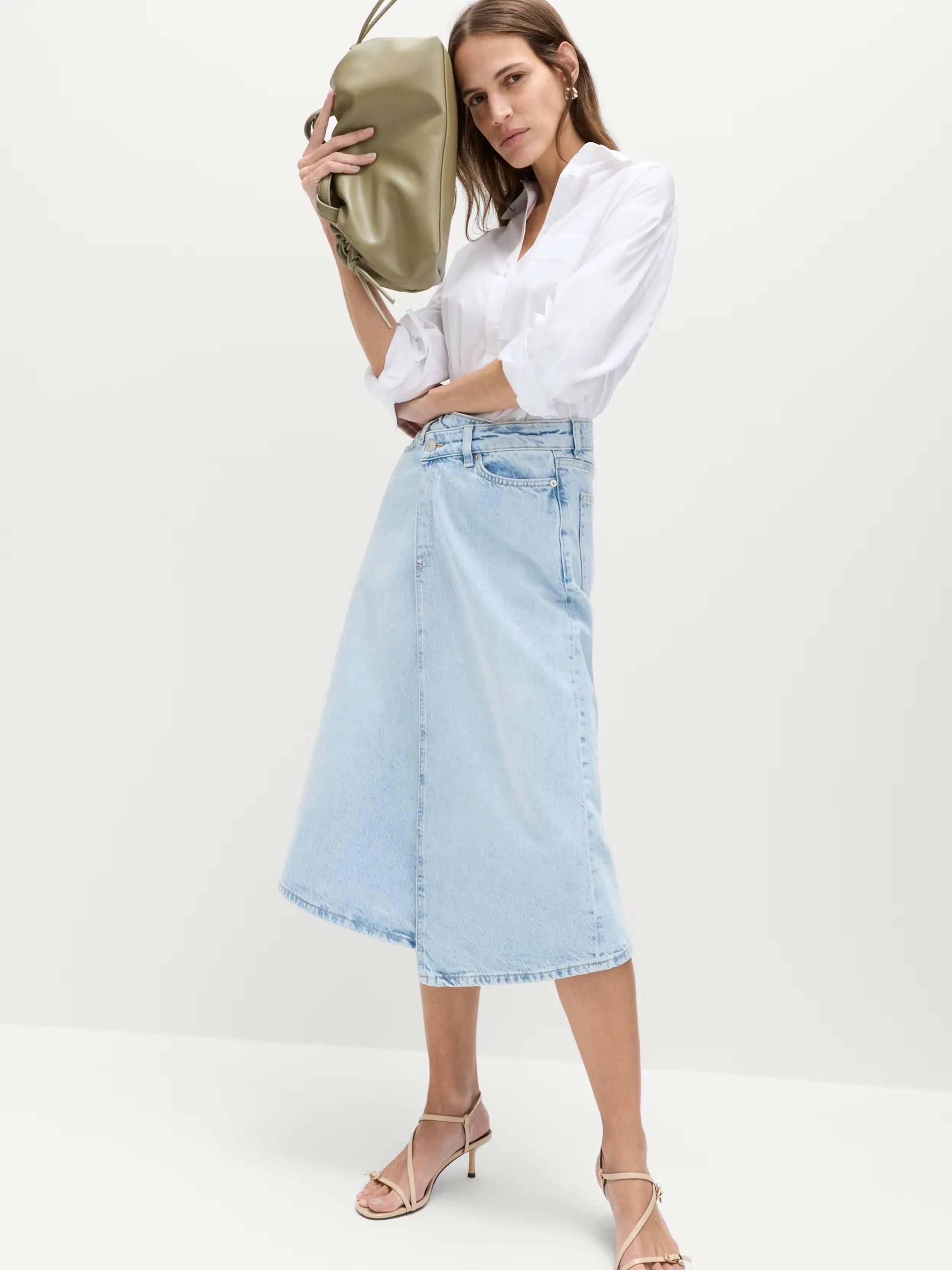 Woman in long denim skirt
