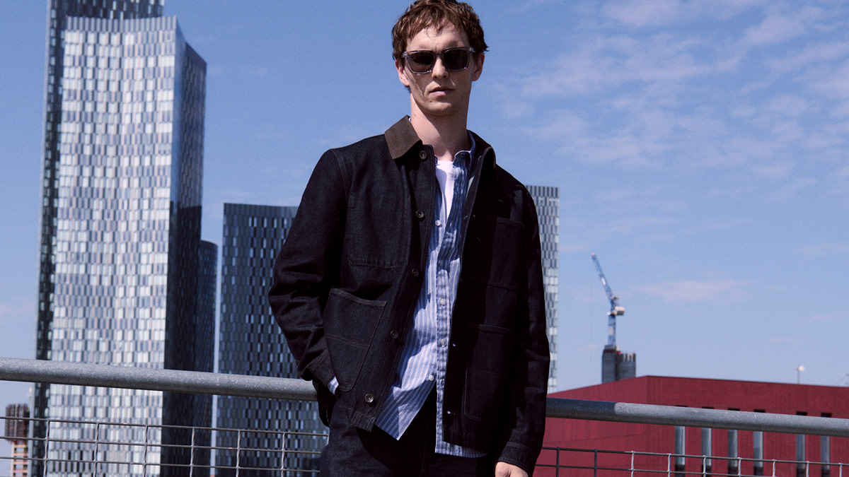 Man wearing navy jacket and blue shirt