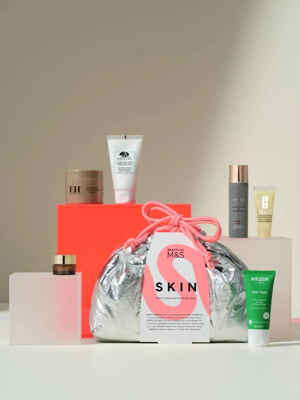 M&S metallic beauty bag with various skin products alongside it