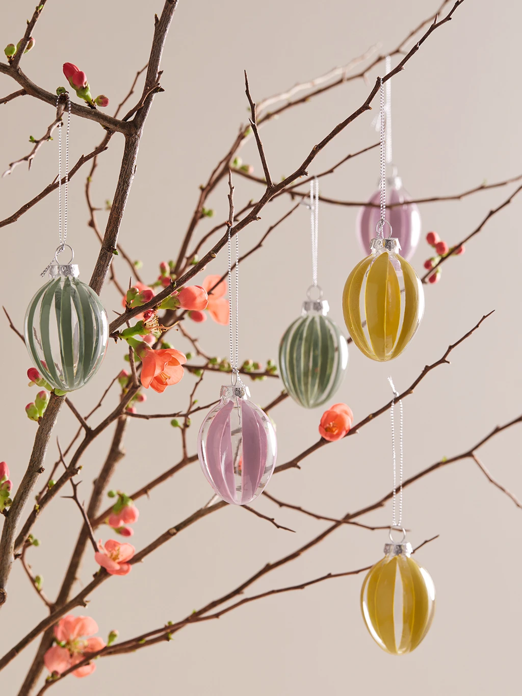 Blossoming branch decorating with hand-painted glass Easter egg decorations