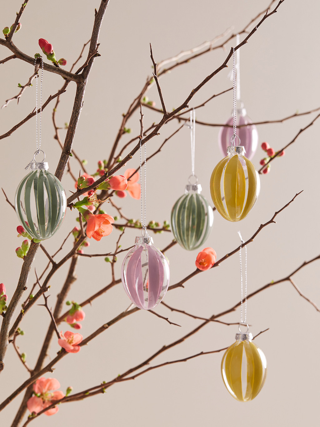 Blossoming branch decorating with hand-painted glass Easter egg decorations