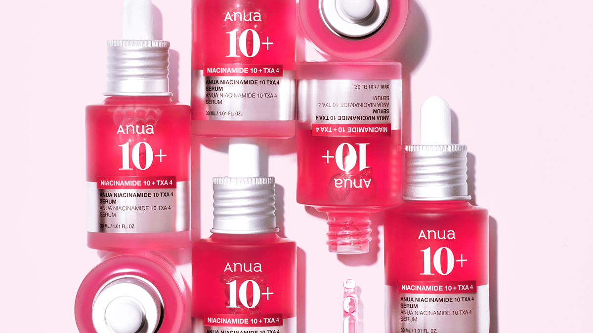 Group of Anua beauty products in pink bottles.
