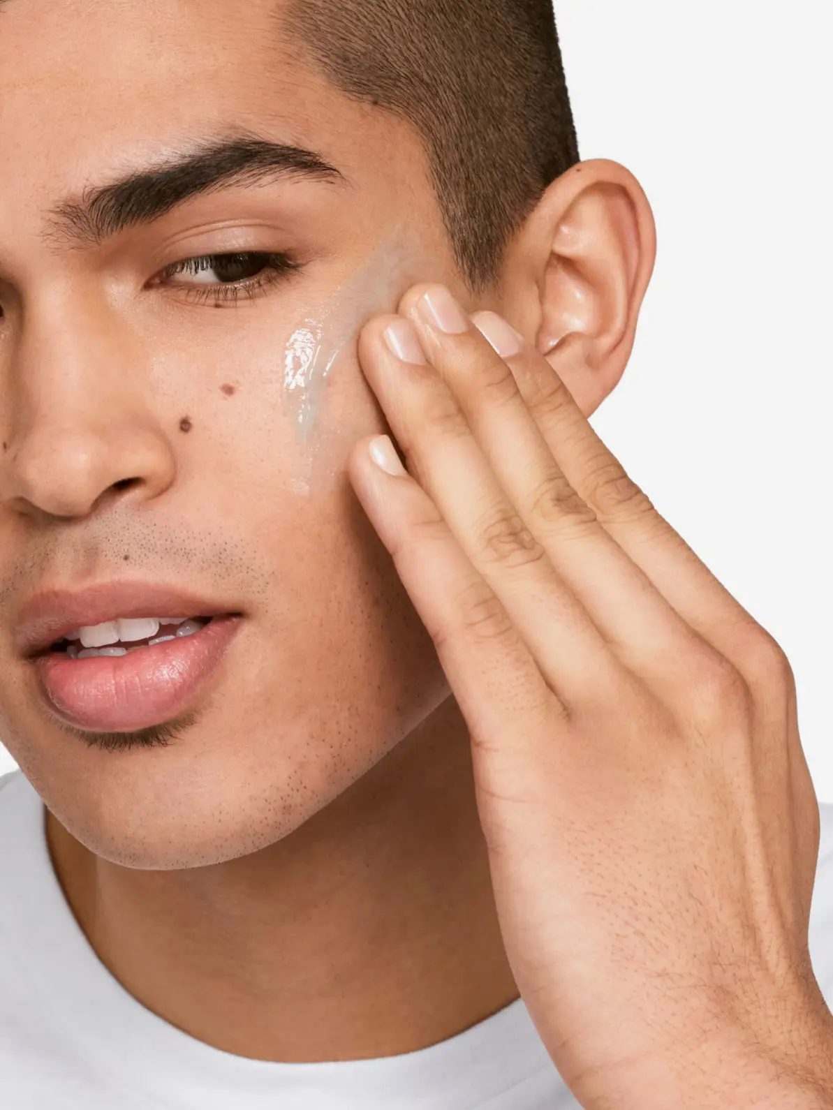 Man applying skincare