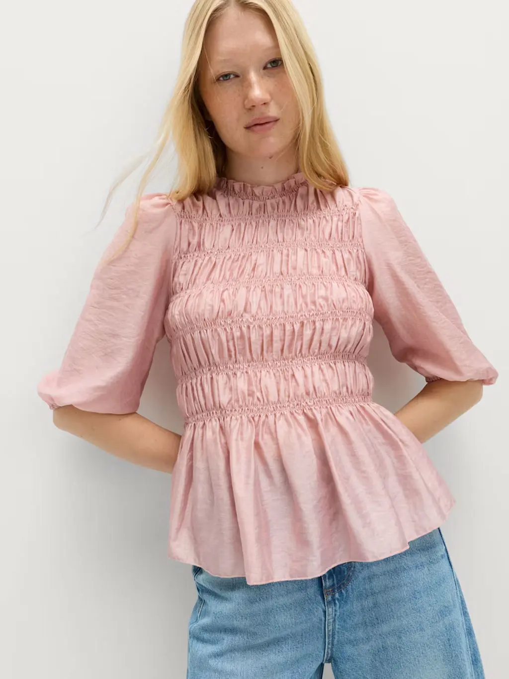 Girl wearing a pink puff-sleeve blouse