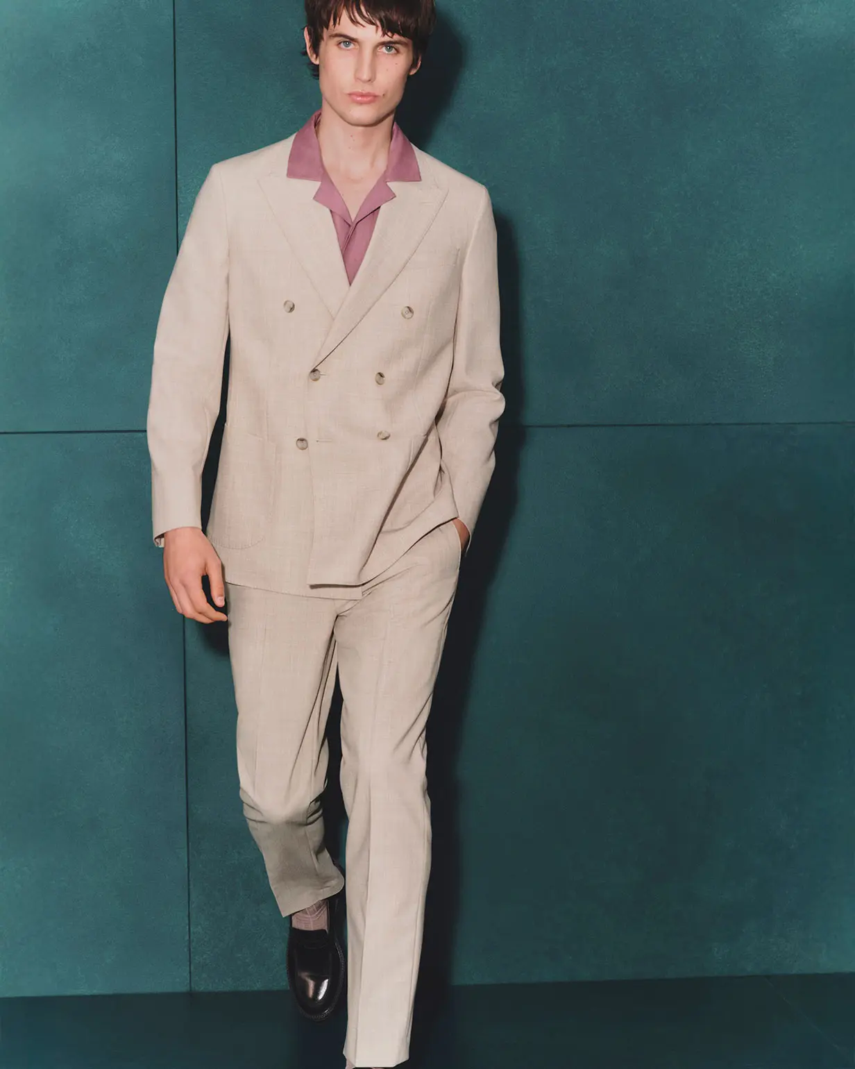 Man wearing cream suit