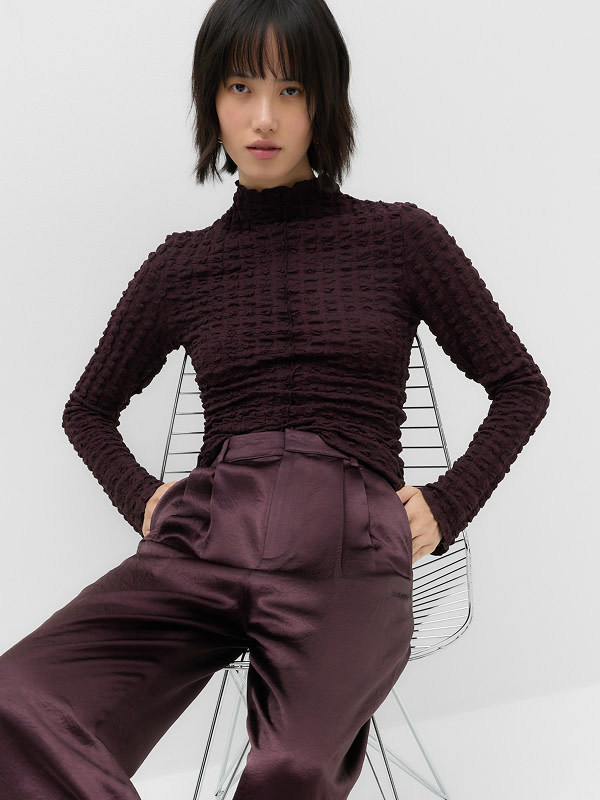 Woman wearing burgundy outfit