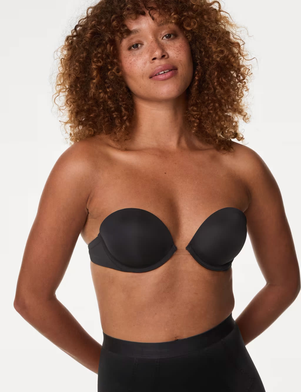 Woman wearing black strapless bra