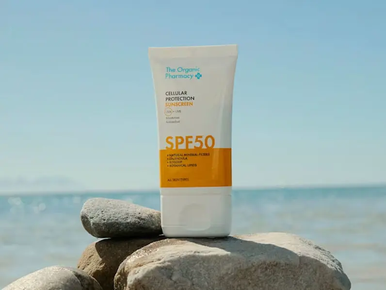 Sunscreen on pile of rocks at beach