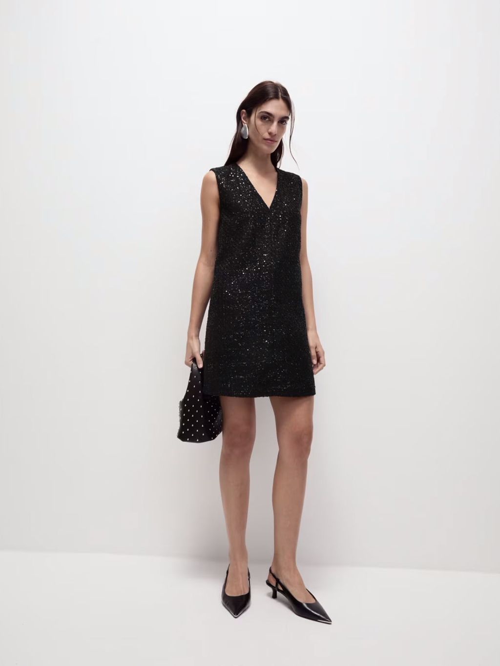 Woman wearing black sequinned mini dress