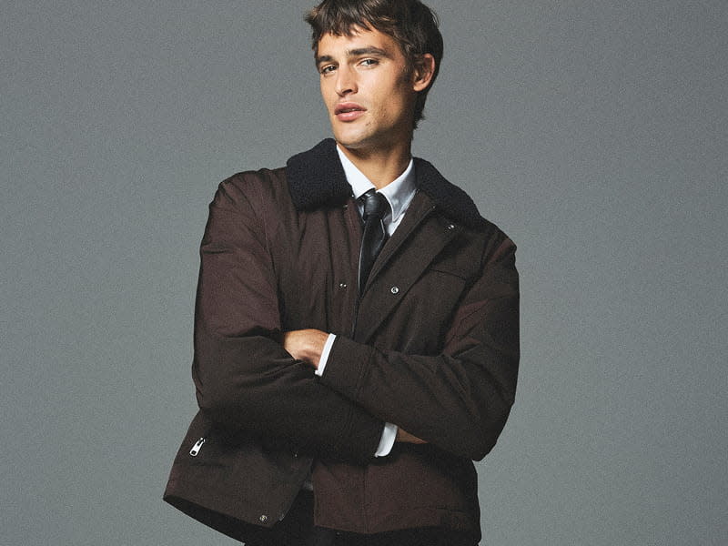 Man wearing brown puffer jacket