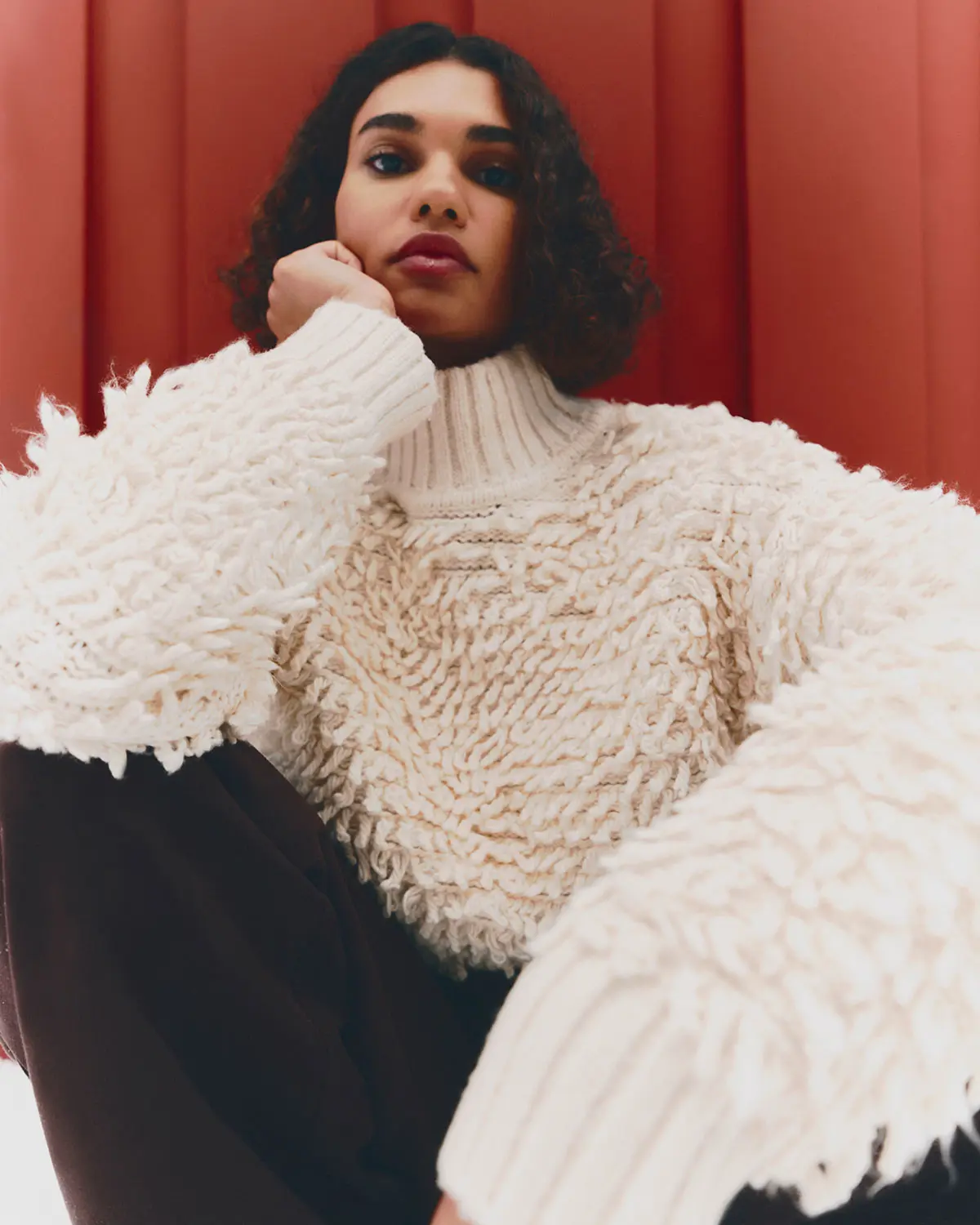 Woman wearing cream fluffy jumper