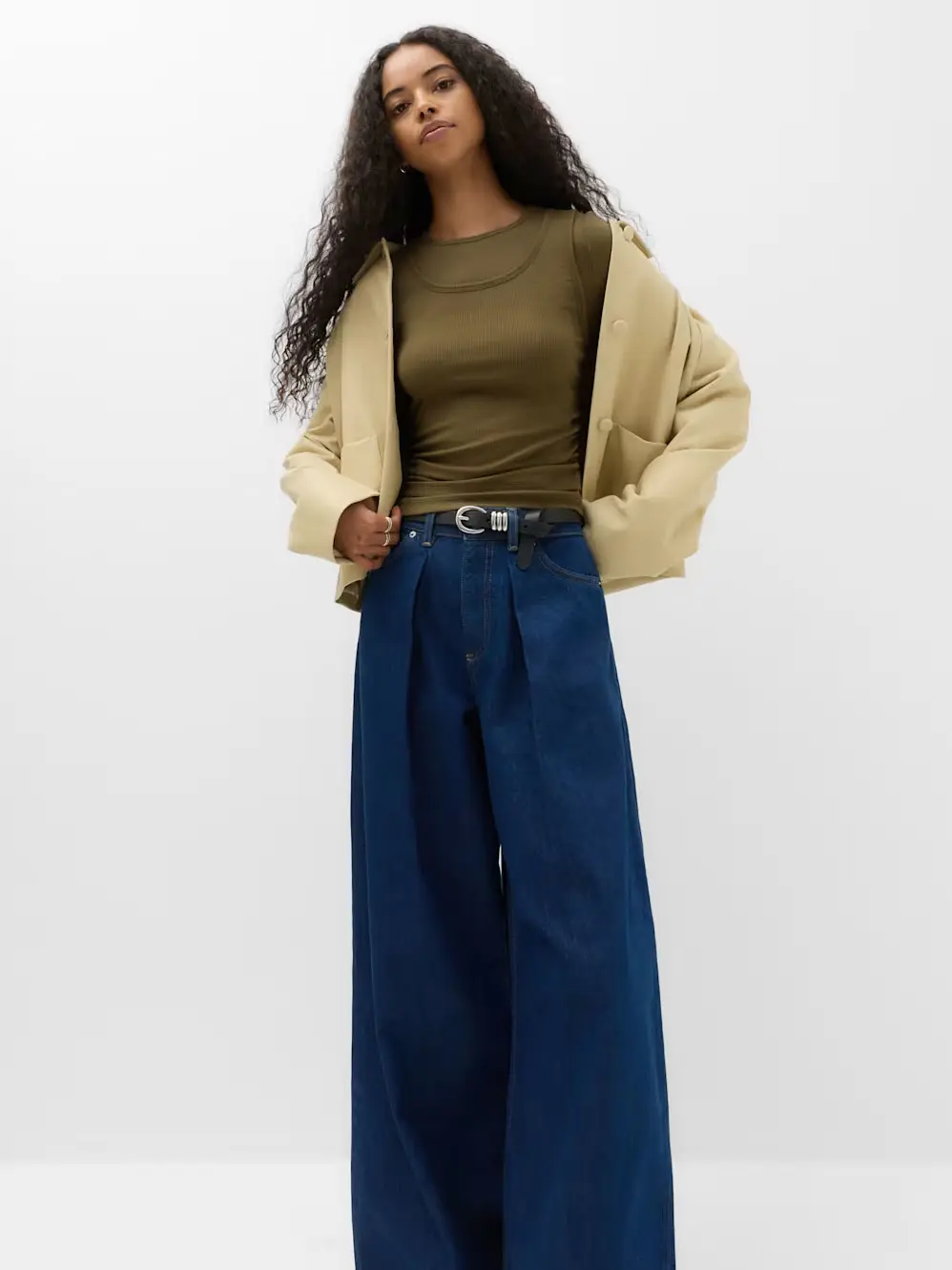 Woman in green top and jeans