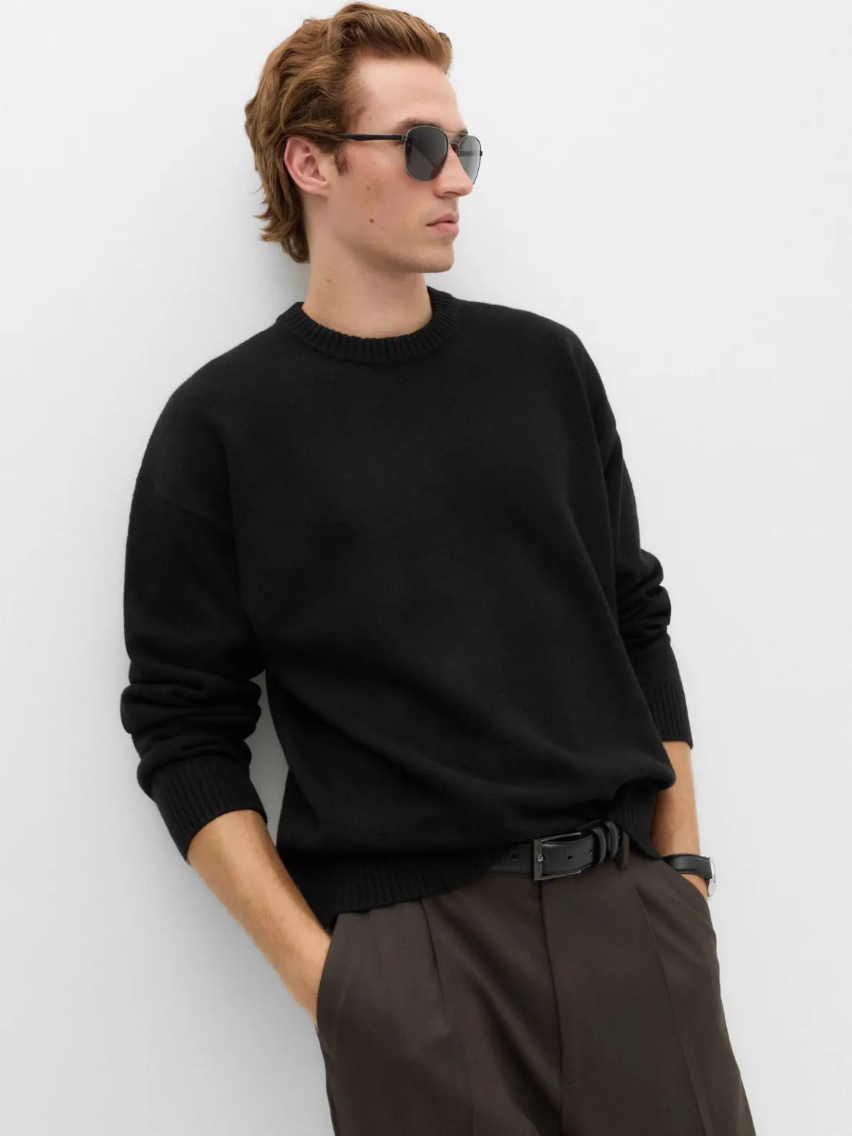 Man wearing black crew-neck jumper