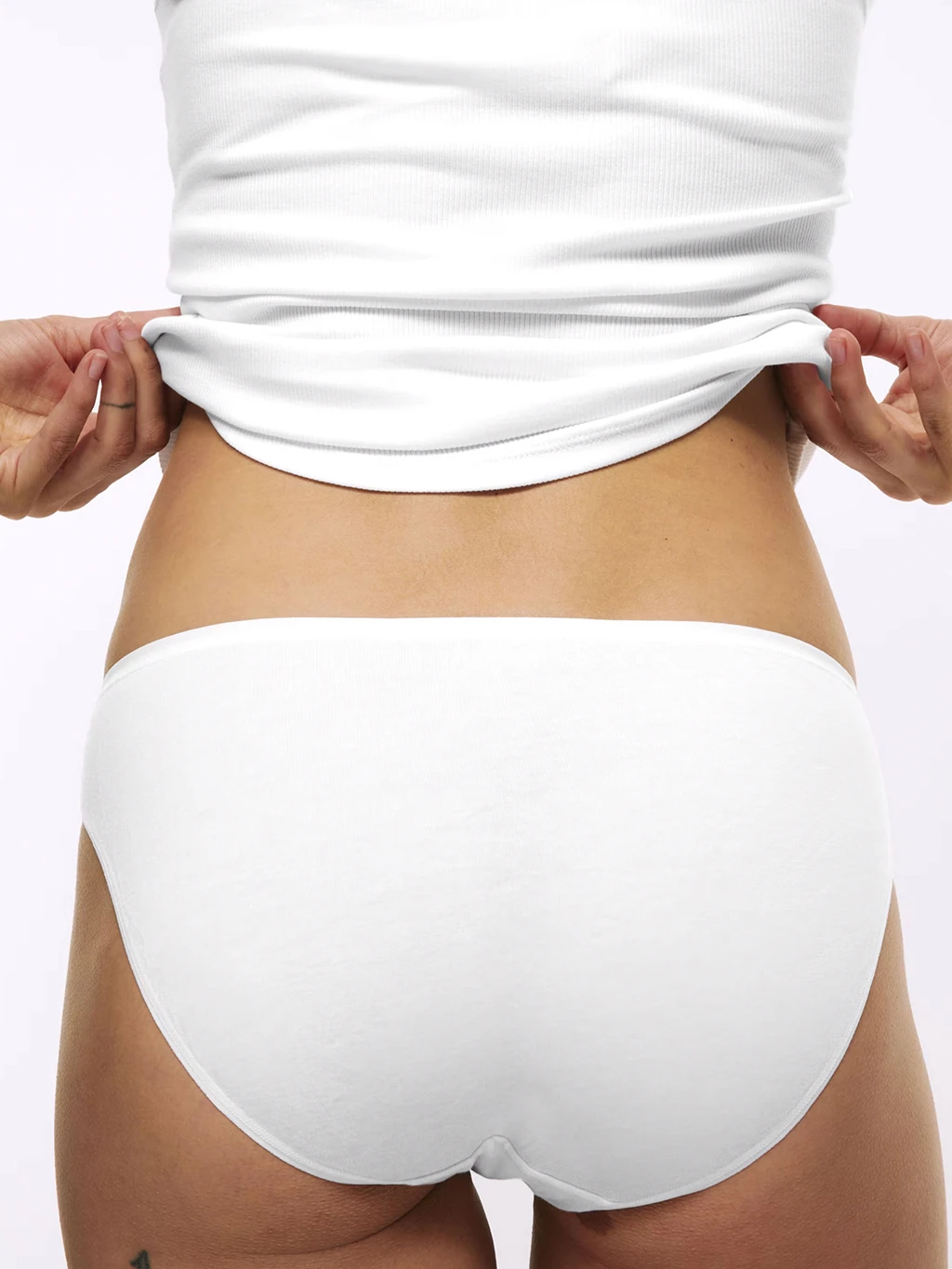 Woman wearing white vest and white no-VPL knickers