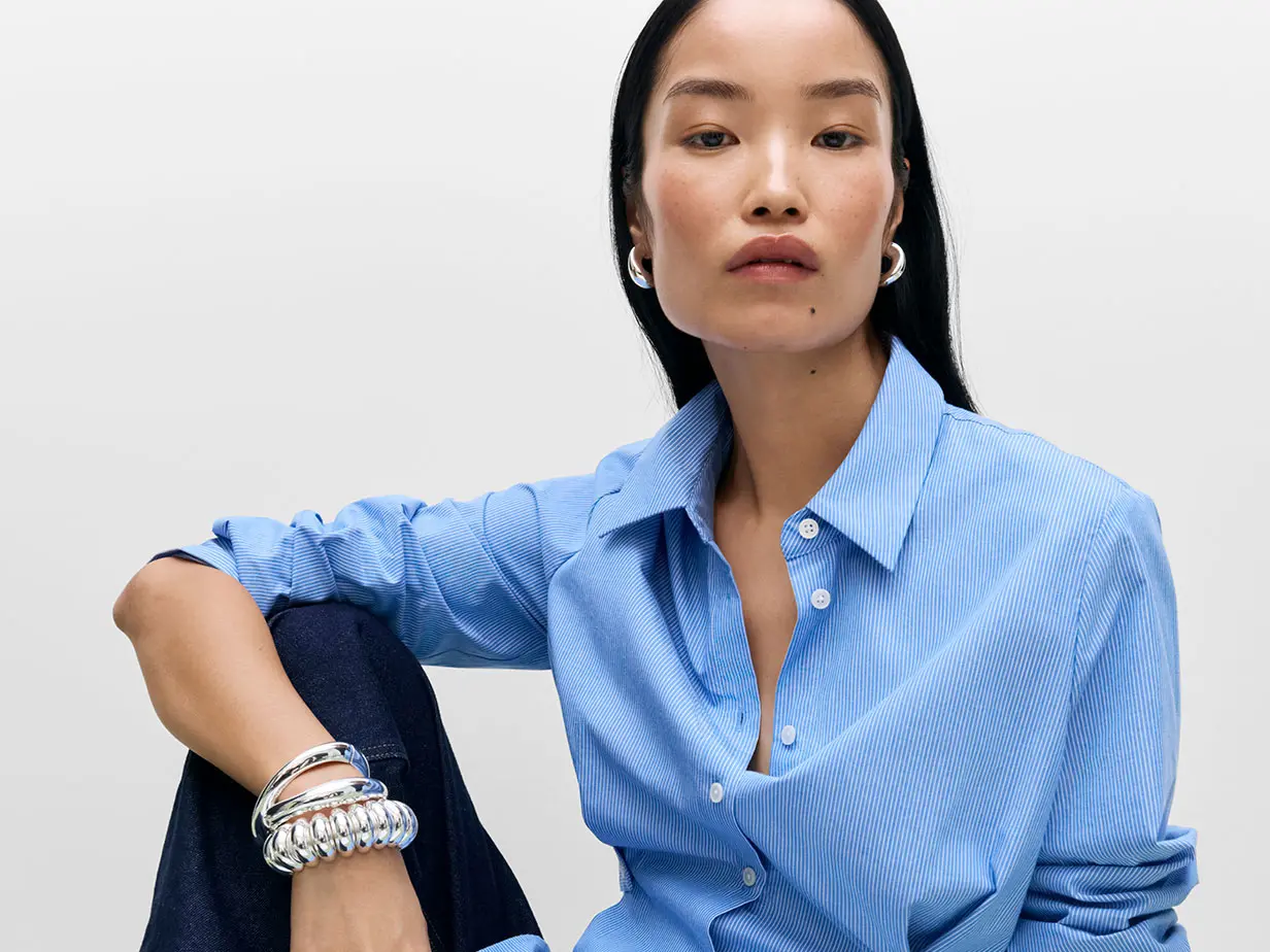 Woman wearing blue shirt and jeans