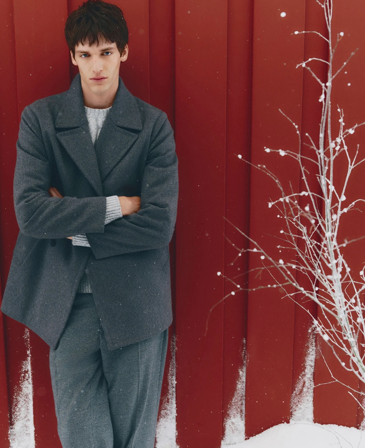 Man wearing grey tailored jacket and grey trousers