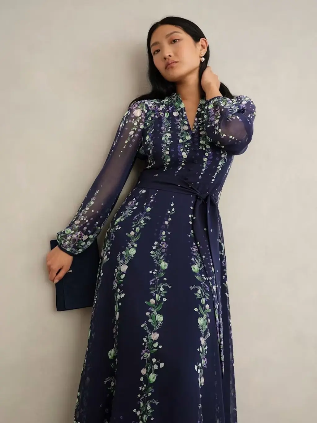 A woman wears a silk floral dress by Hobbs for petite mother of the brides