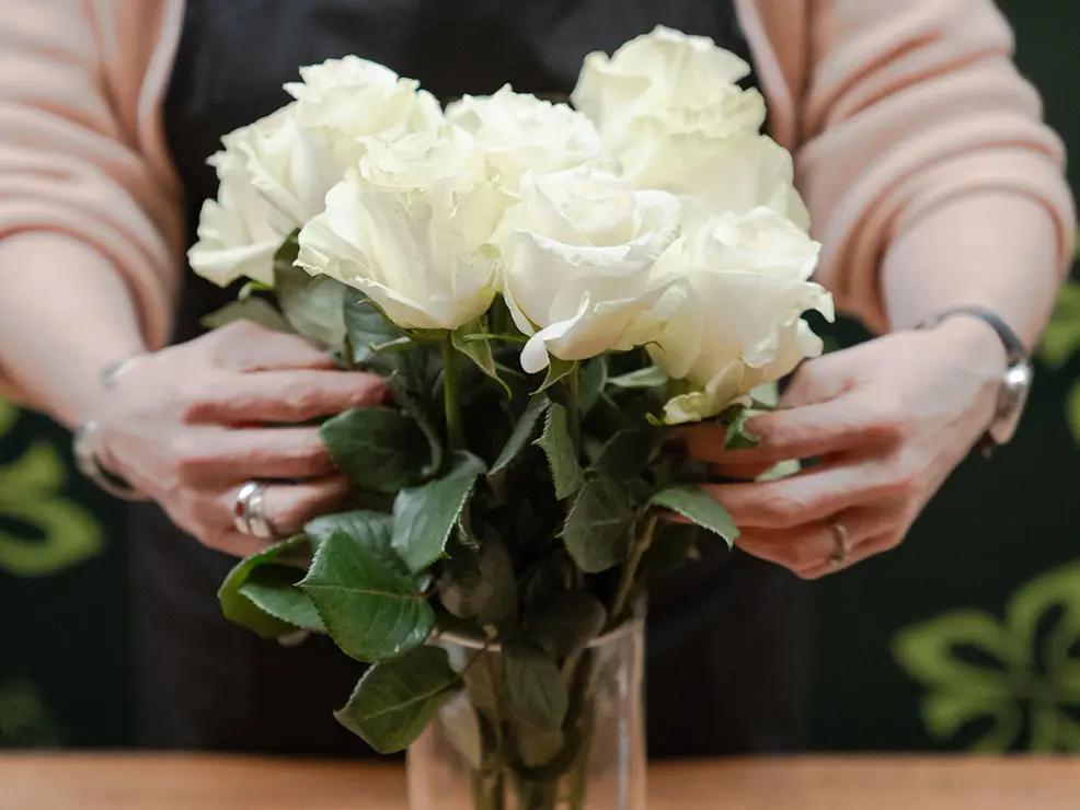 Florist arranging roses at M&S