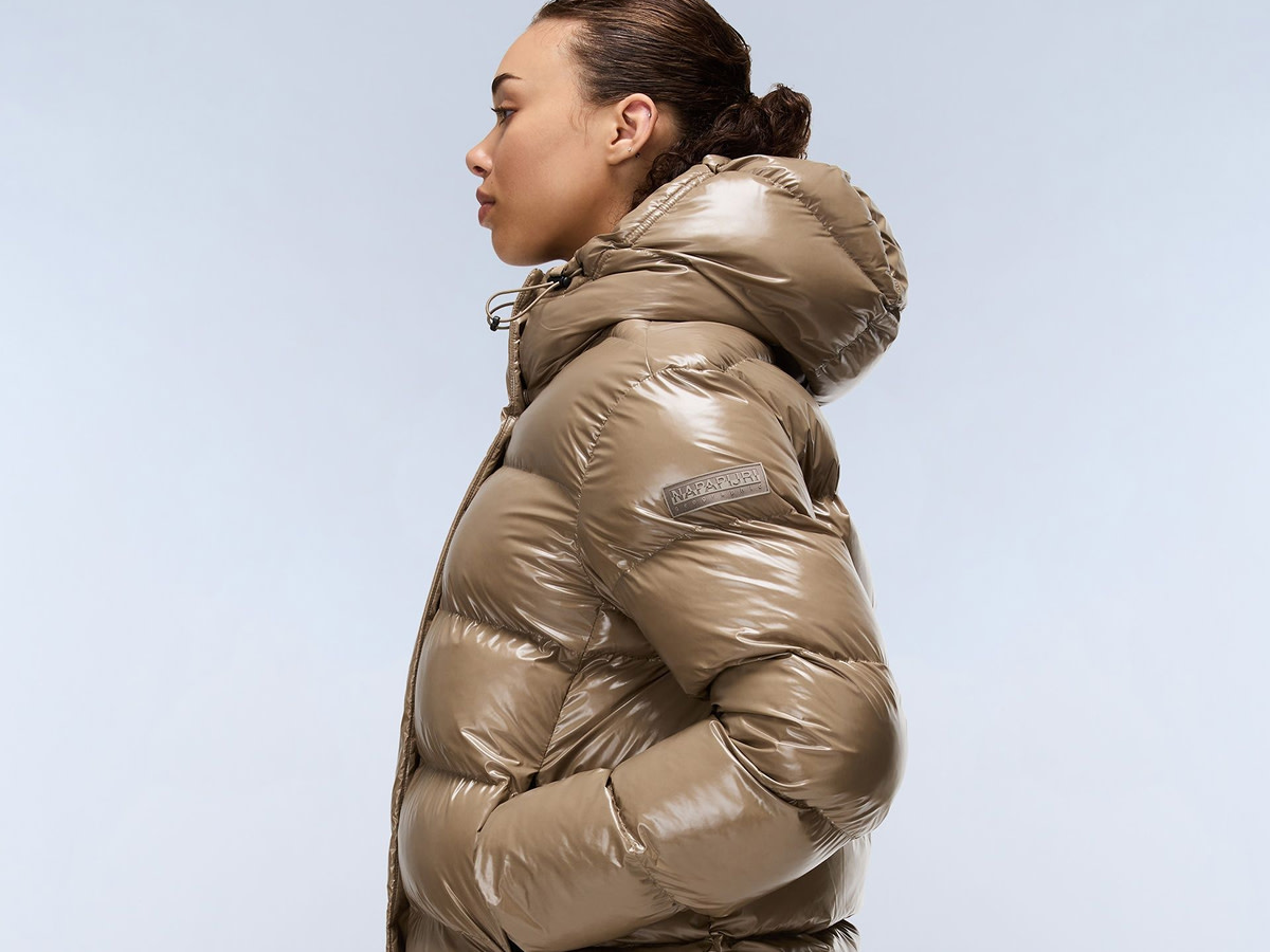 Woman wearing tan puffer coat by Columbia