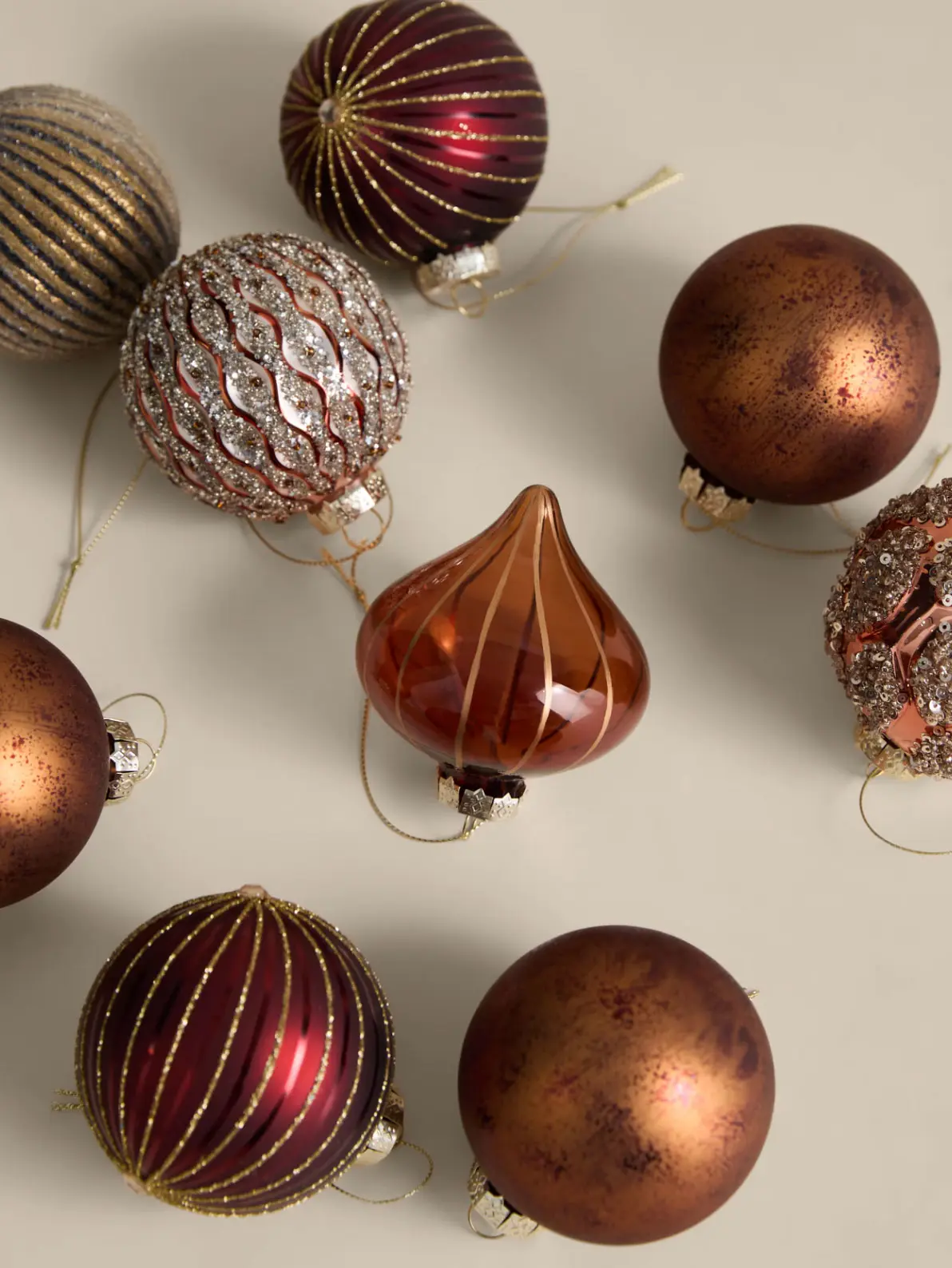 Image of brown, gold and red Christmas baubles 