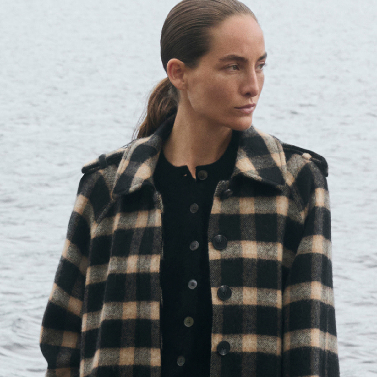 Woman wearing checked coat