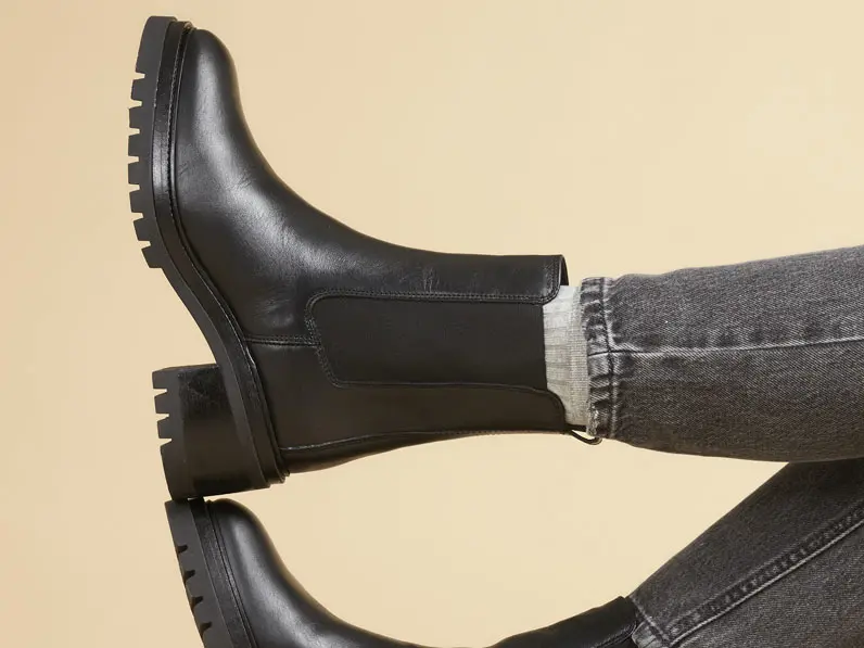 Woman wearing black ankle boots