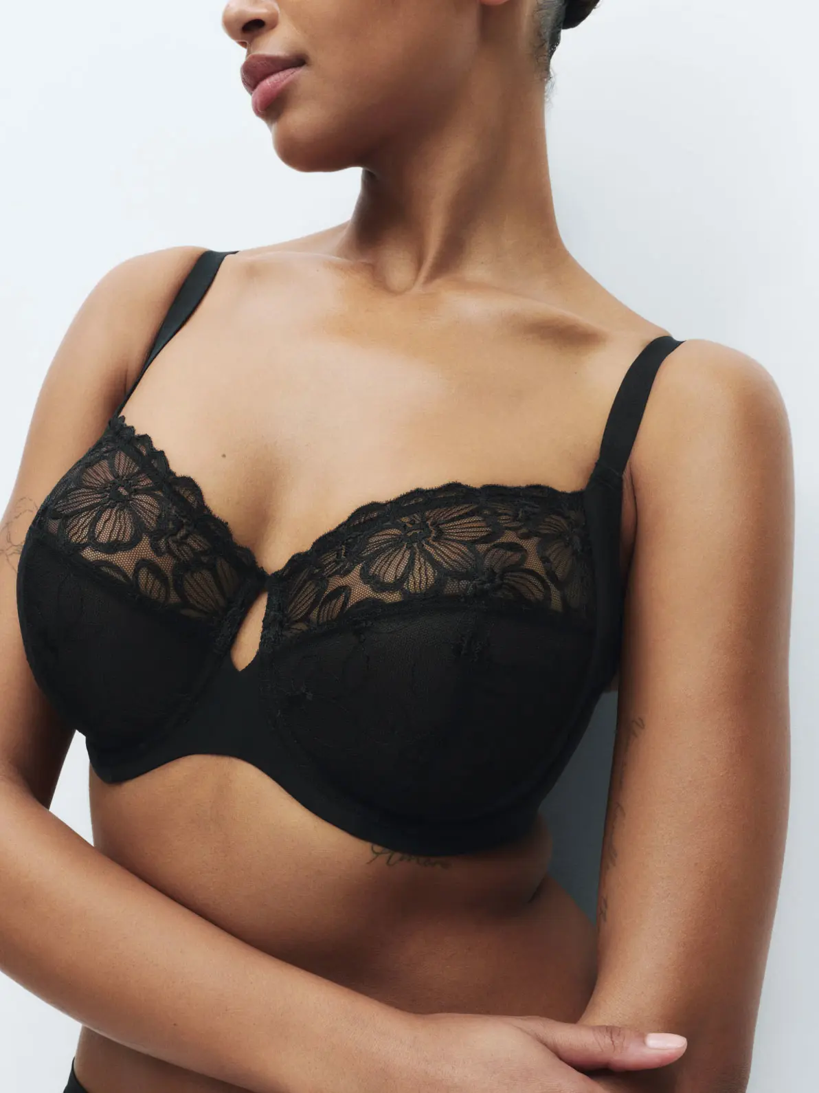 Woman wearing black bra with lace details