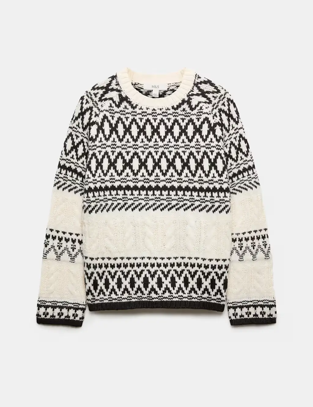 Cream cable jumper knitted in a black Fair Isle pattern.