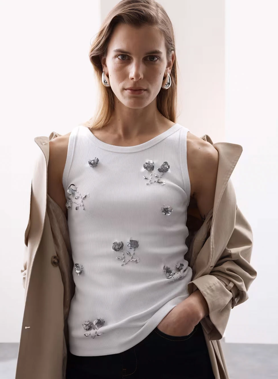 Woman wearing silver sequinned cami top