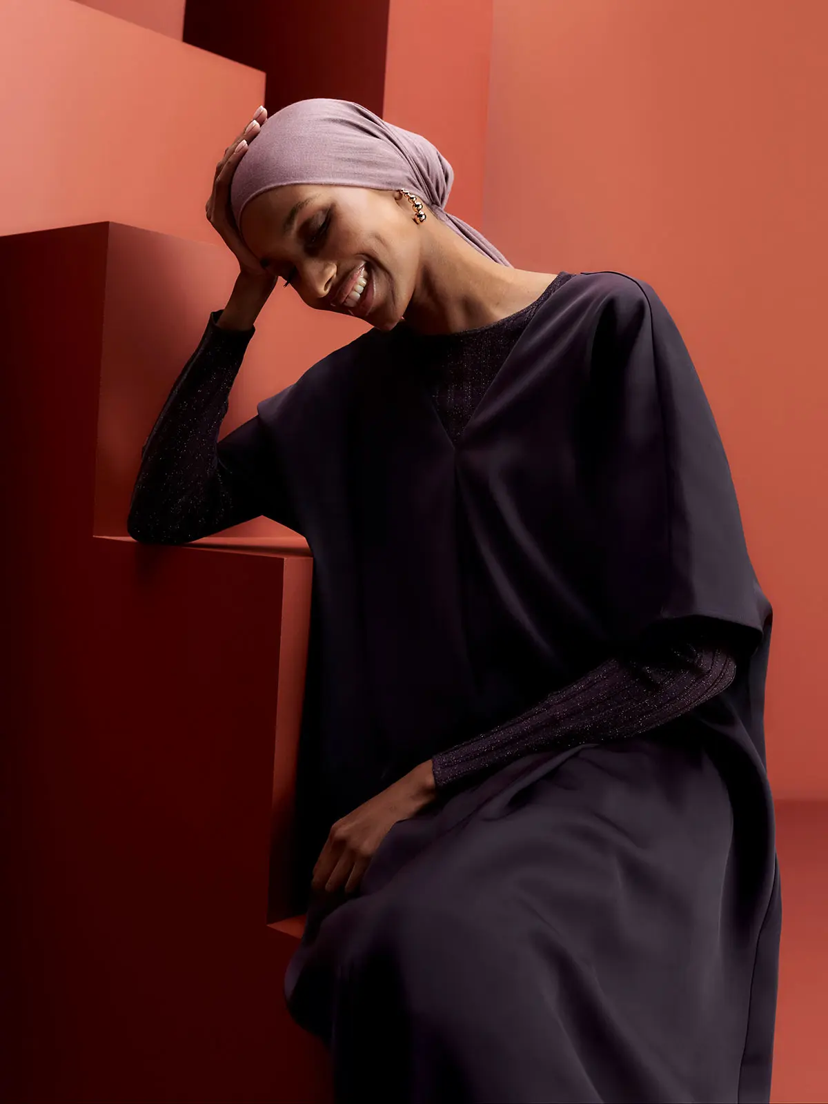 Woman wearing deep purple outfit 