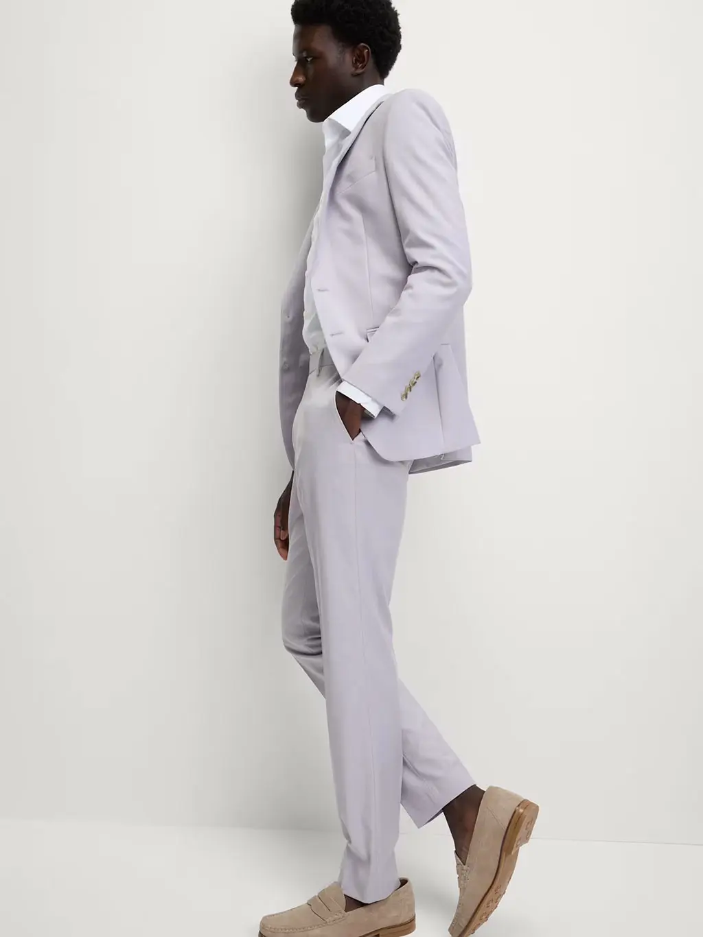 Man in light purple suit