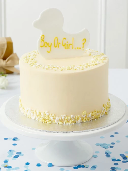 White gender reveal cake