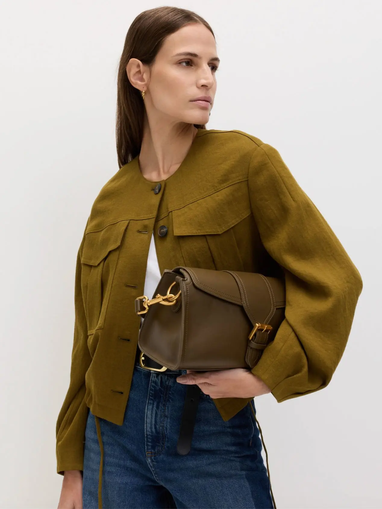 Woman wearing jacket with blue jeans