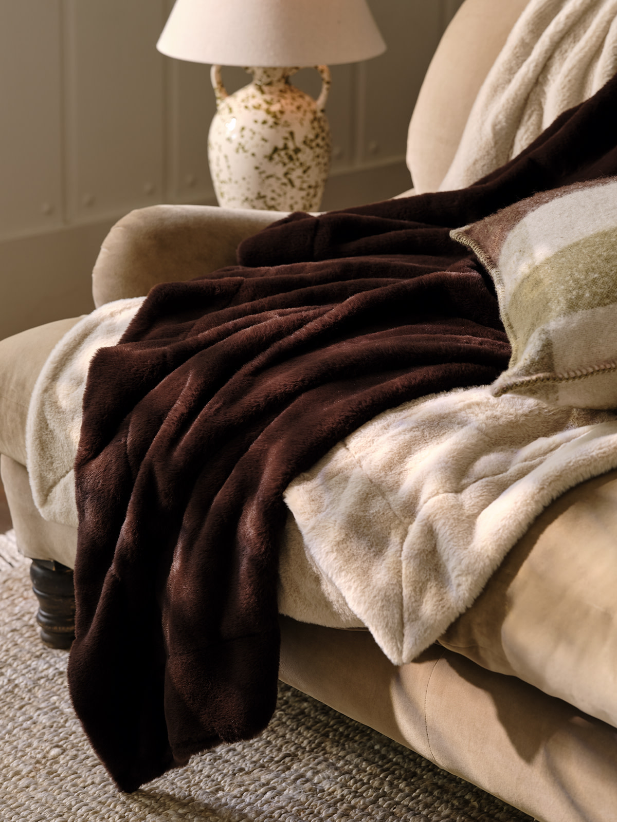 Faux fur throws on a bed