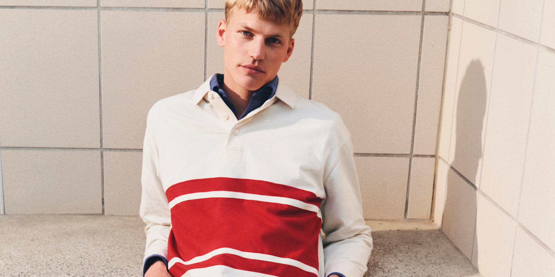 Man wearing polo T-shirt