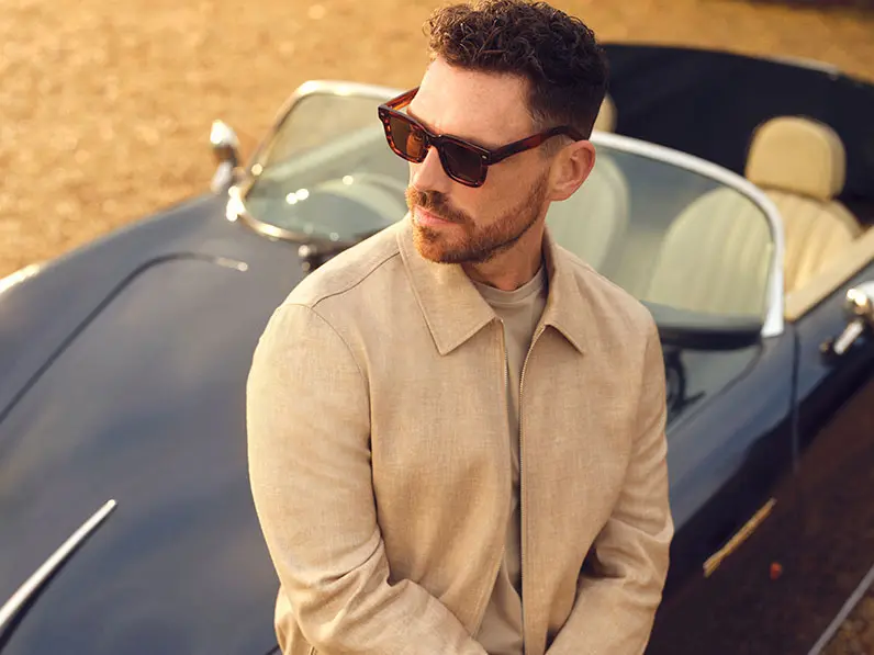 James Nelson Joyce in tan linen jacket and trousers