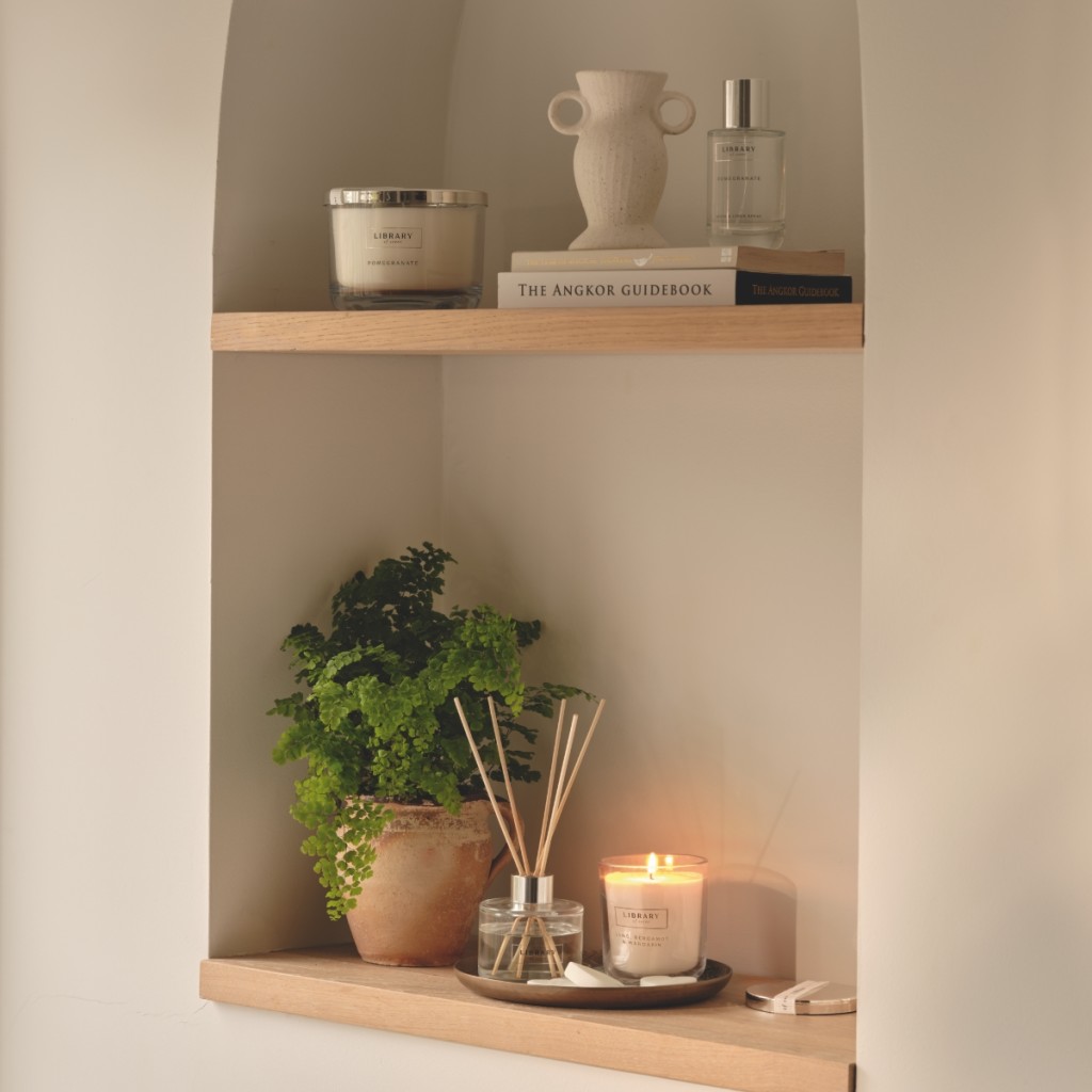 Selection of candles, diffuser and fragrance on a shelf. Read the feature
